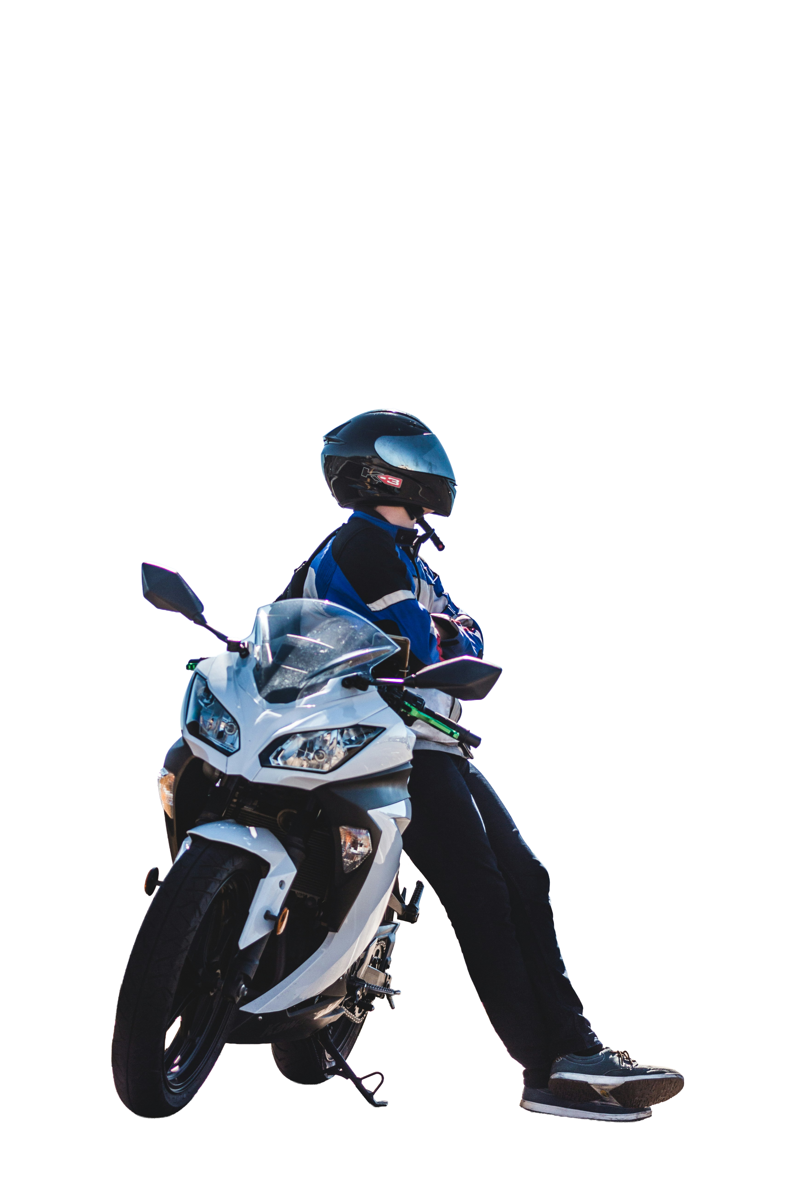 Rider on a motorcycle over a purple crescent