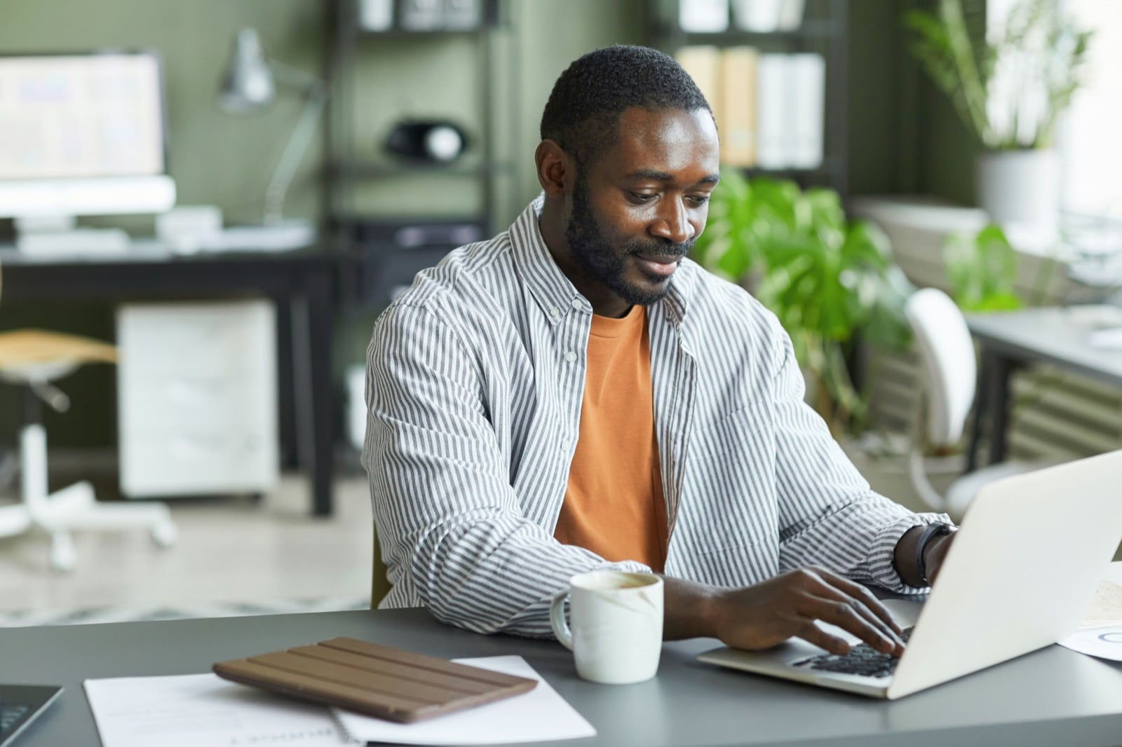 Member making a loan payment on a laptop